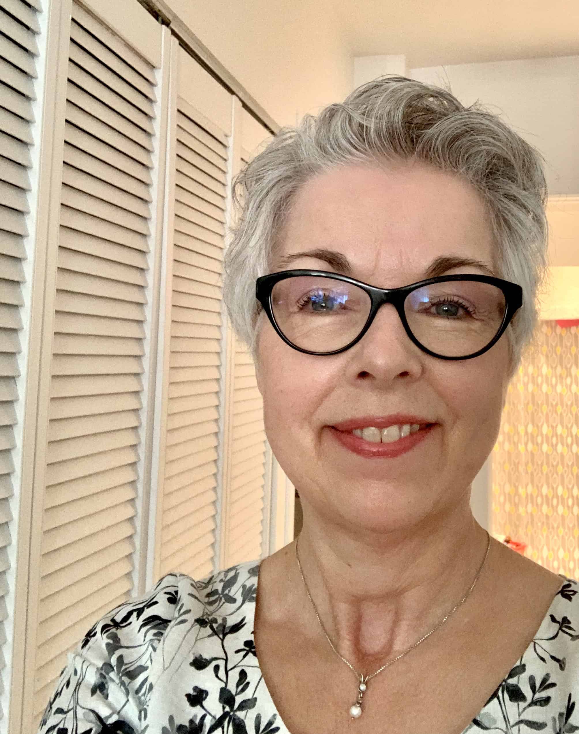 profile picture of a women with glasses and short silver hair